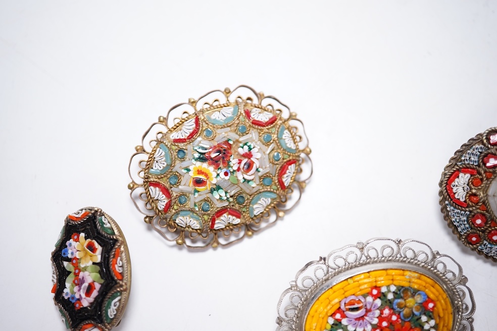A collection of twenty-eight micro-mosaic brooches, including ten banjo and guitars shaped brooches, six similar large oval brooches, nine small brooches and three long brooches. (28) Condition - good